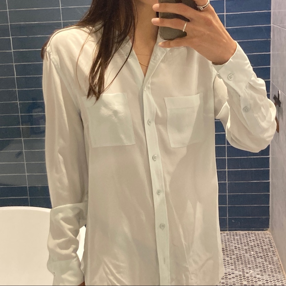 100% silk light blue Equipment top, size small.